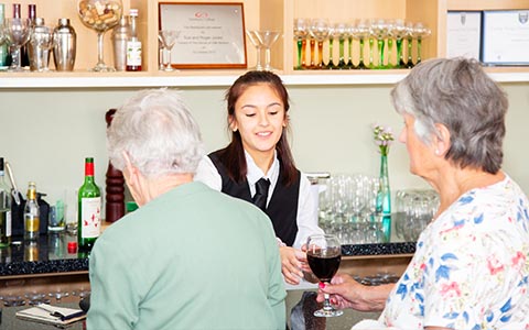 Hospitality student serving customers