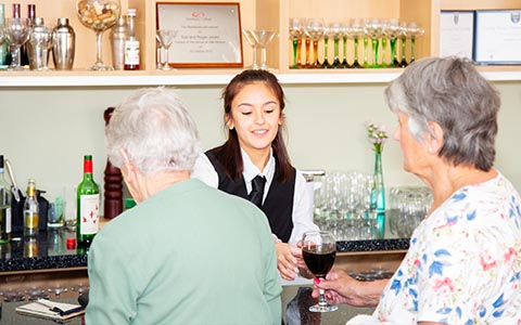 Hospitality student serving customers